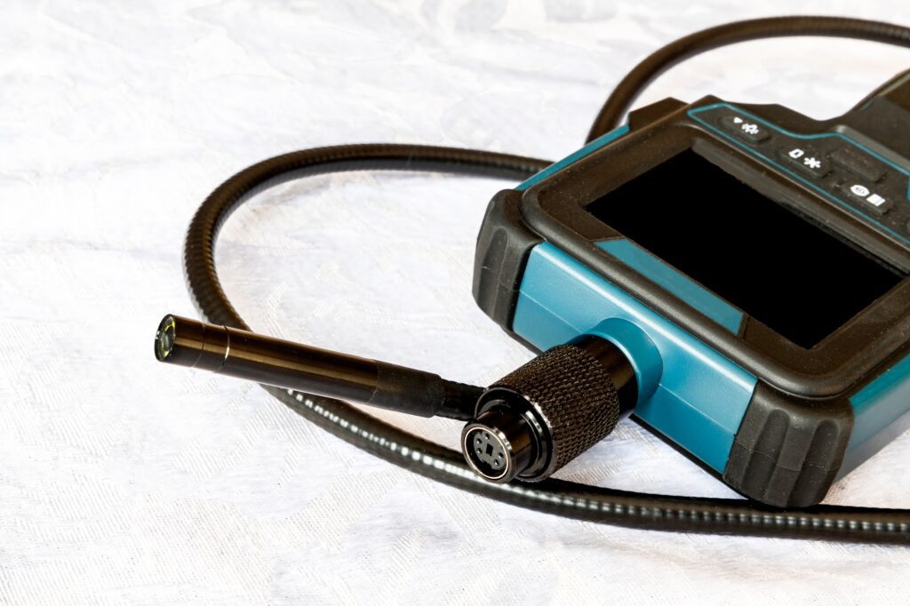 Endoscope camera on the table. Flexible inspection camera