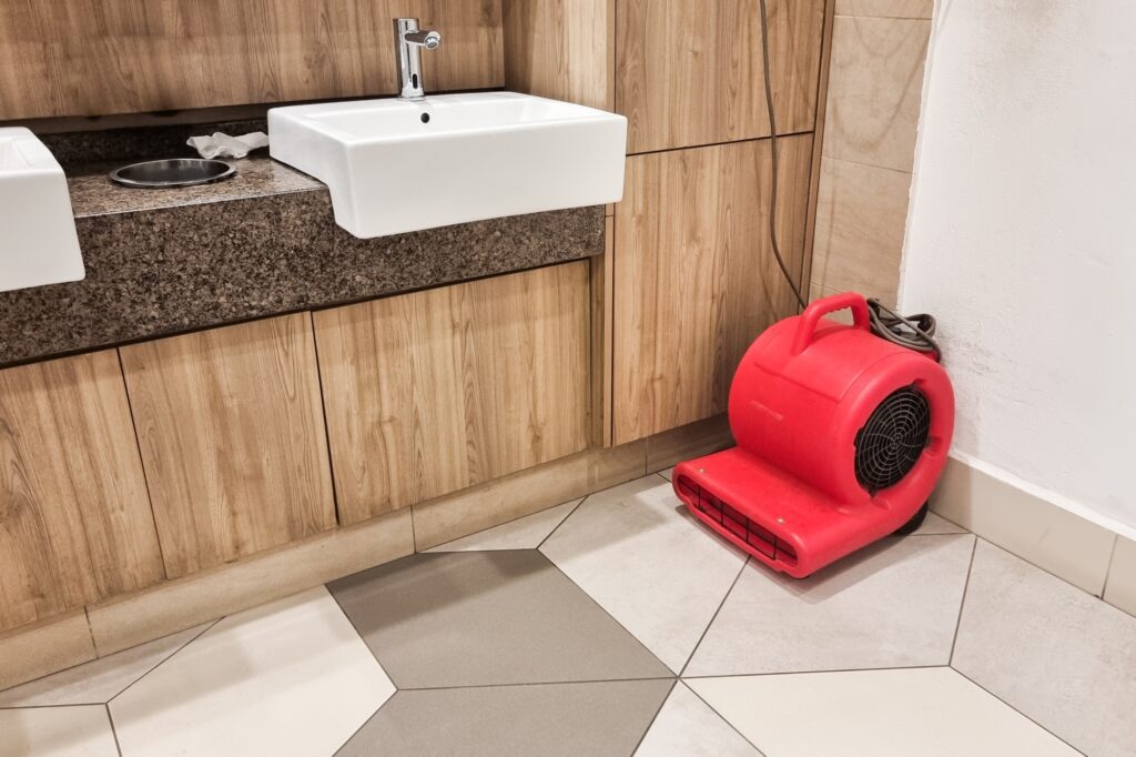 Floor dryer fan used in public washroom and toilet to dry the floor after washing and cleaning