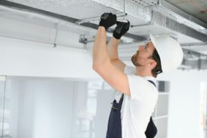 Relief Services Plumbing & Air Conditioning 19 HVAC technician performing emergency AC repair in Tampa home
